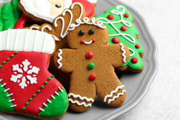Tasty homemade Christmas cookies on light grey table, closeup