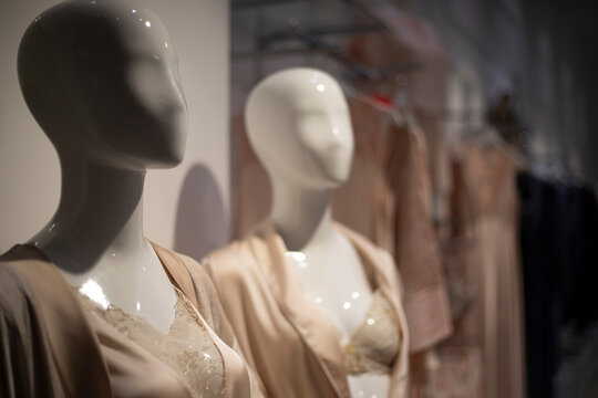 A mannequin on display in a lingerie store. White female mannequin.