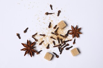 Different spices on white table, flat lay
