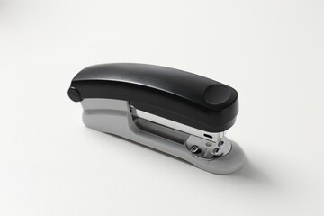 One stapler on white table. Office stationery