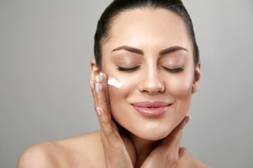 Face Skin care. Beautiful woman with healthy smooth facial clean skin .Beauty face care.Facial treatment.Cosmetology.Spa