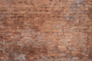 Background and Wallpaper or texture of dark discolored old brick wall ancient vintage retro style.