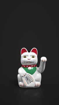White fortune cat waves paw on black background. Maneki-neko cat waving his paw. Traditional beckoning cat figure loop, loopable animation.