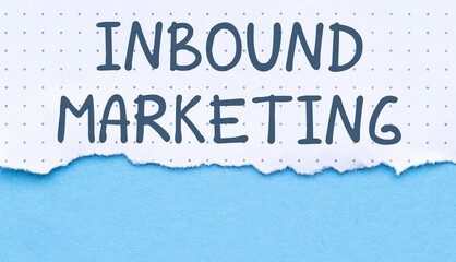 Torn paper with the words Inbound Marketing written on it with a blue background