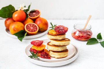 Stack of pancakes with blood orange and honey 