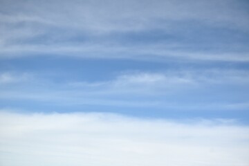 cloud spreading on bright sky in sunny day 