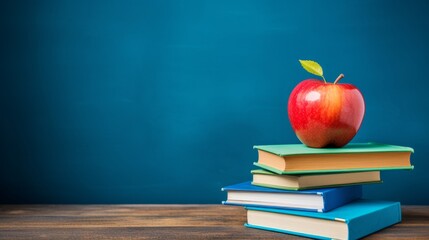 Red apple on a stack of books, symbolizing knowledge and healthy eating