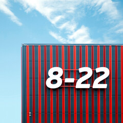 Abstract architecture image with work hours on supermarket wall - 755825669