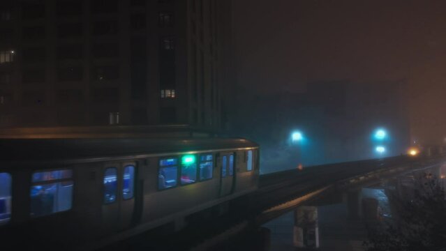 Train passing on Elevated Track at fogy Night. Subway in downtown Chicago downtown 