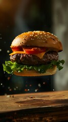 Tasty hamburger with flying ingredients on dark background. High resolution image.