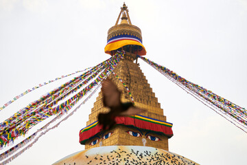 Boudhanath stupa in Kathmandu, Nepal decorated Buddha wisdom eyes and prayer flags, most popular...