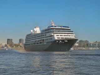 Luxury cruiseship cruise ship liner Quest on River Elbe towards Hamburg Hafen port in Germany with...