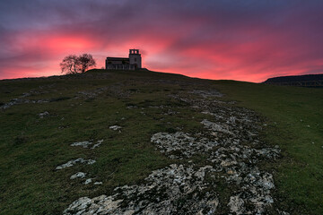 Hermitage of San Pantaleón de Losa in the Losa valley, Burgos, with a sky of intense colors