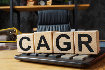 Cubes with abbreviation CAGR Compound annual growth rate on a calculator.