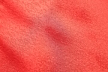 Texture of red fabric as background, top view