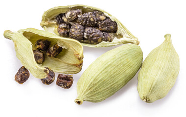Green cardamom pods and seeds isolated on white background.