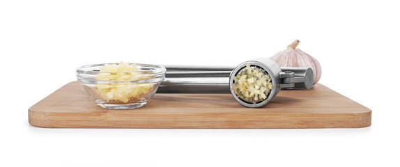 Board with one metal press and garlic isolated on white