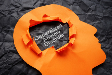 Torn paper head and inscription Generalized Anxiety Disorder GAD. © Vitalii Vodolazskyi