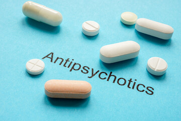 Sheet with inscription antipsychotics and tablets. - obrazy, fototapety, plakaty