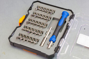 Universal tool box, tool kit closeup with set of hex, torx and screwdriver bits, and various sizes...