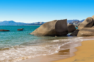 Huge rocks on the shore of the South China Sea in the World's End park. Sanya, China