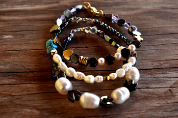 A group of bracelets on a wooden surface