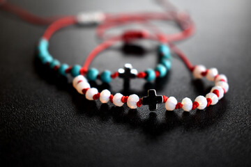 two crystals bracelets on a black surface