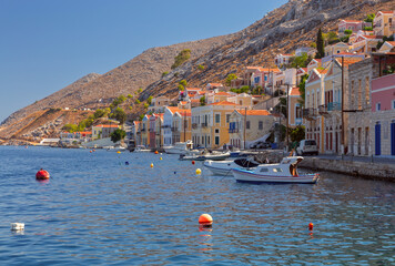 Multi-colored facades of houses in the Greek village Symi on a sunny day - 755858465