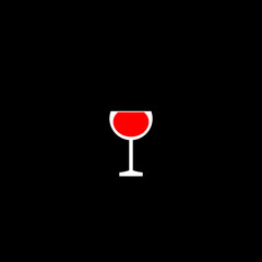 Glass red wine with a drop of drink inside  on black background