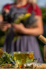 A woman brews herbal tea. Selective focus.