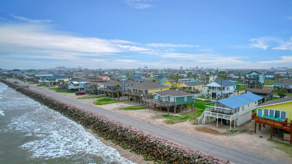 Fototapeta na wymiar Beachfront village with several small houses by the sea: Texas Coastline
