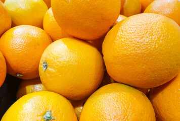 Orange fruit background. Ripe natural oranges fruit.