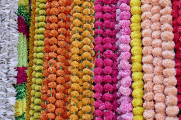 Colorful flower garlands at market stall in Ahmedabad, India