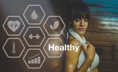 Portrait of a beautiful young woman relaxing in a sauna. Healthy, wellness lifestyle, spa concept.
