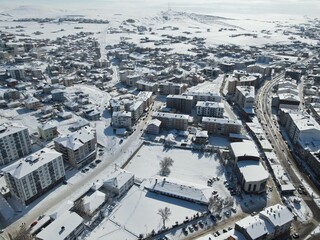 Naklejka na ściany i meble Top view from a drone of a snowy city. Sarikaya,Yozgat,Turkey