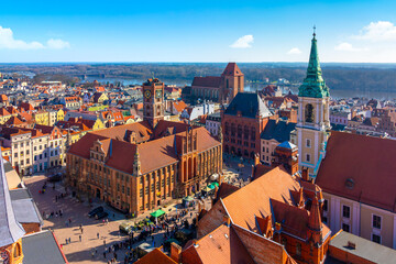 Aerial panoramic view of historical buildings and roofs in Polish medieval town Torun - obrazy, fototapety, plakaty