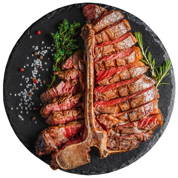 Dry Aged Barbecue Porterhouse Steak T-bone beef steak sliced with large fillet piece isolated on white background. clipping path included