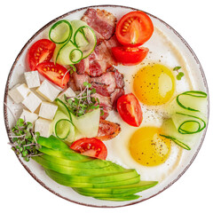Healthy nutritious paleo keto breakfast diet Fried eggs, bacon, avocado, cheese and fresh salad isolated on white background. clipping path included