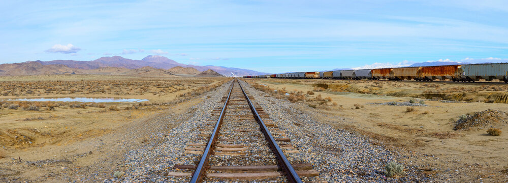 Endless Journey: 4K Ultra HD Image of Railroad Tracks in the Desert