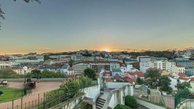 Panorama showing Jardim do Torel timelapse, a traditional garden and viewpoint with unusual views to the city center of Lisbon during sunset. It has a terrace, a bar and a large pond. Portugal
