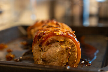 Baked pork wrapped in a roll. Pork roll close-up.