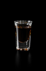 Shot glass with orange drink