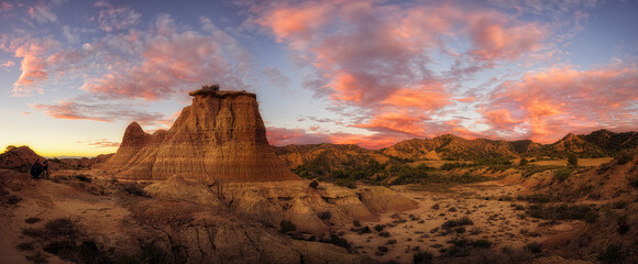 Sunset in the Monegros desert, Zaragoza, with the Tozal El Solitario under a sky of warm colors