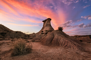 Sunset in the Monegros desert, Zaragoza, with the Tozal El Solitario under a sky of warm colors