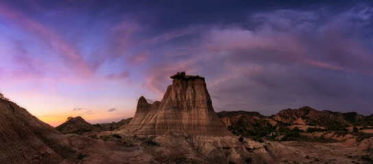 Sunset in the Monegros desert, Zaragoza, with the Tozal El Solitario under a sky of warm colors