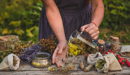 woman brews herbal tea. Selective focus.
