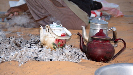 Tea kettle on the cooking fire during a camel trek in the Sahara Desert, outside of Douz, Tunisia