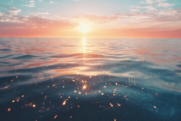 The sparkling surface of a calm ocean at sunrise - obrazy, fototapety, plakaty