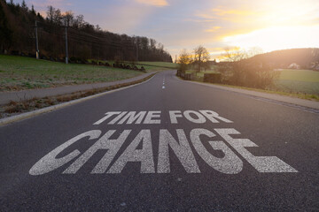 Road concept, time for change, image of a road to the horizon with text time for change.