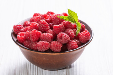 Raspberry in a basket .on wooden background - 755931283